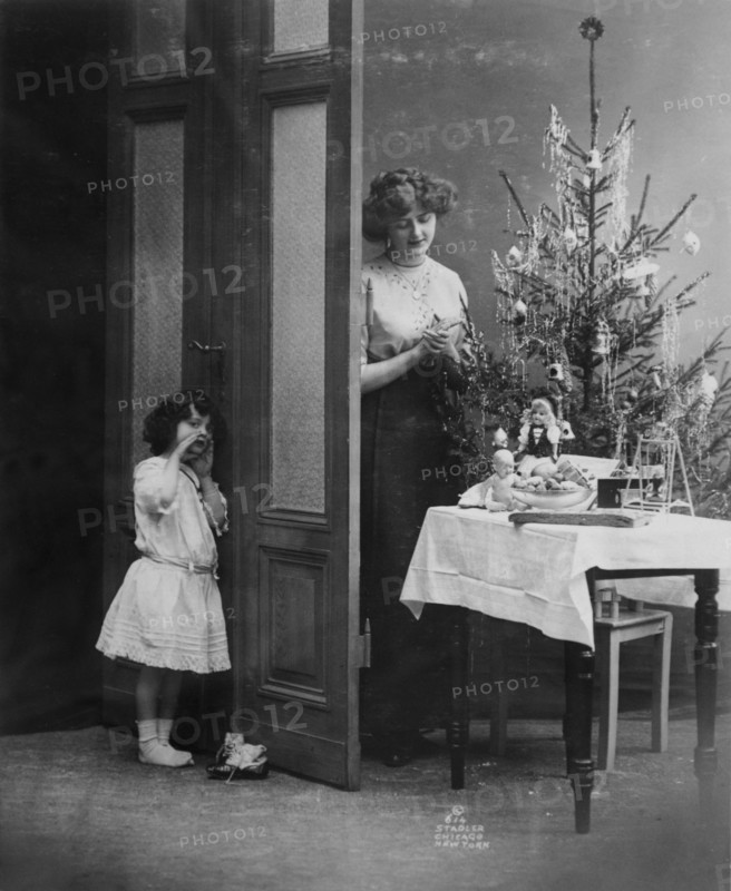 Mother and child with Christmas tree