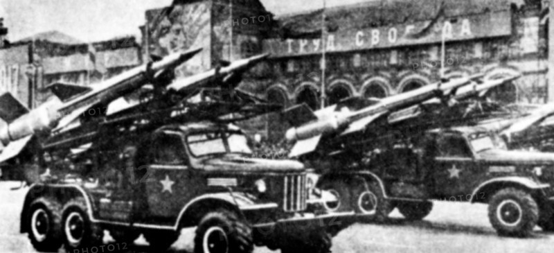 A right front view of several vehicle-mounted Soviet SA-3 Goa surface-to-air missiles.