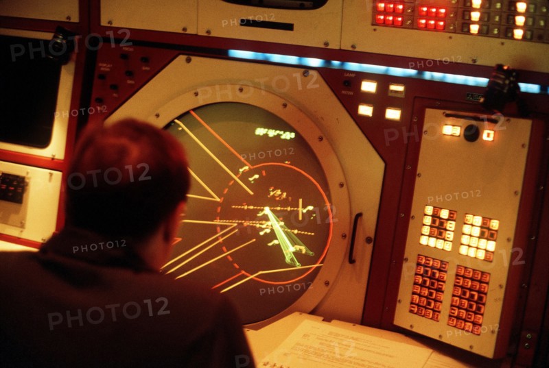 1980s Air Traffic Controllers monitoring a radar screen