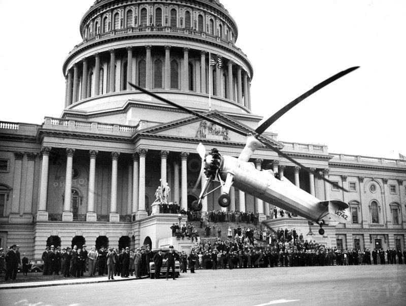 A helicopter type aircraft lands at the U.S. Capitol ca. April 28