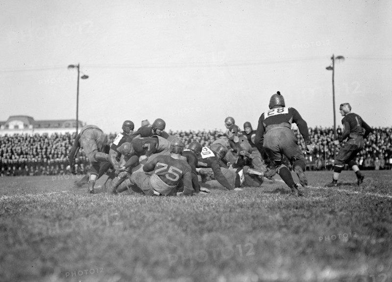 Early 1900s football game in action