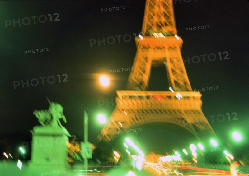 Early 1970s Blurred lights of Paris France at night at the Eifel Tower ca. 1974