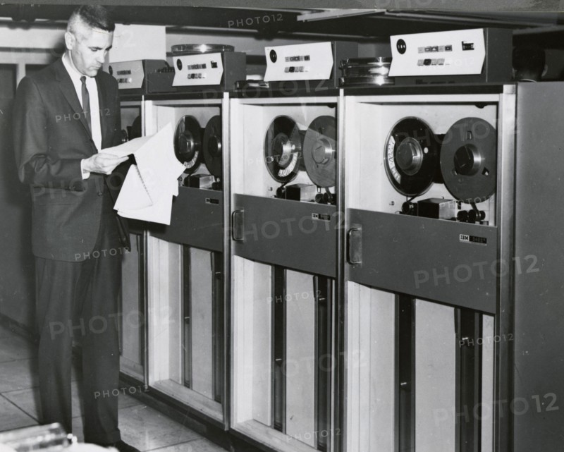 Edward Stone in front of an IBM Computer