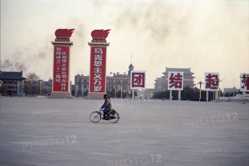 Street Scene with Signs and Bicyclists in Peking