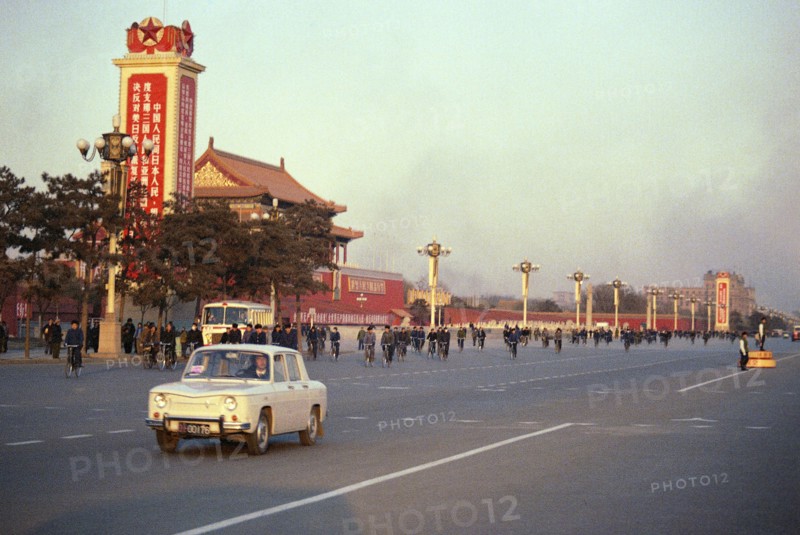 Street Scene with Signs and Bicyclists in Peking