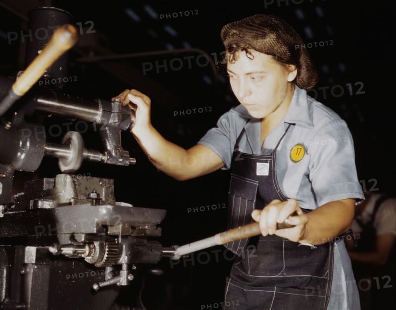 Female machine worker helps in the United States war effort