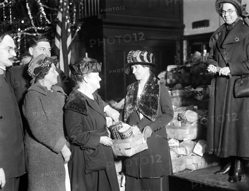 First Lady Grace Coolidge handing out Christmas baskets ca. 1923 or 1924