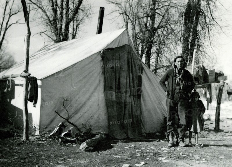 Man and Child in Front of Tent