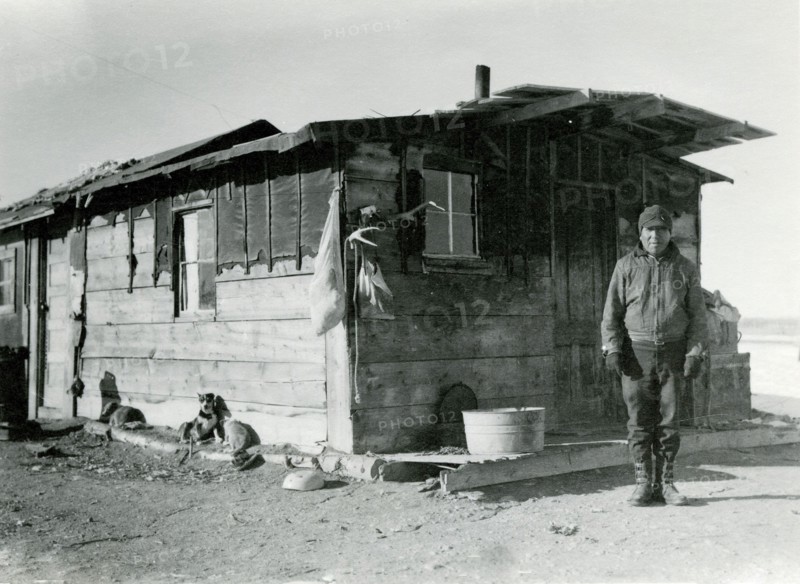 Man in Front of Building with Animals