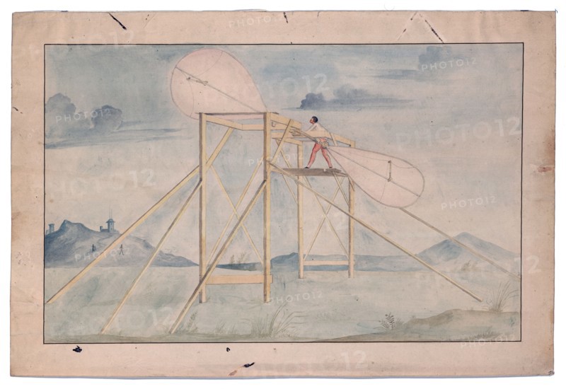 Man standing on a platform manipulating a set of paddle