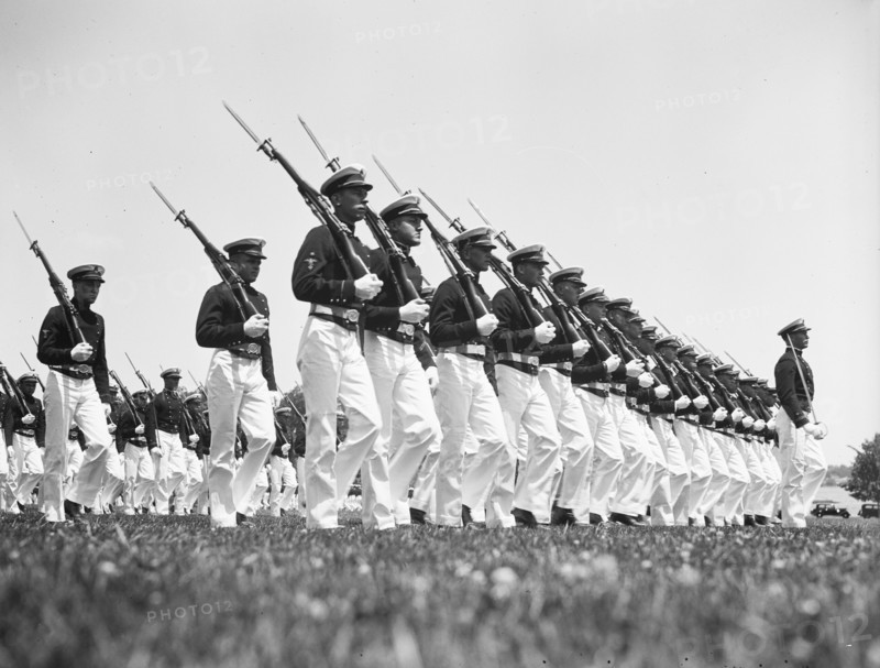 Navy midshipmen drilling