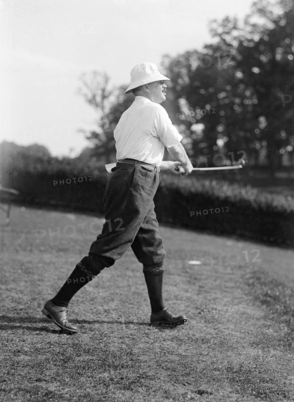 Politician playing golf ca. 1917