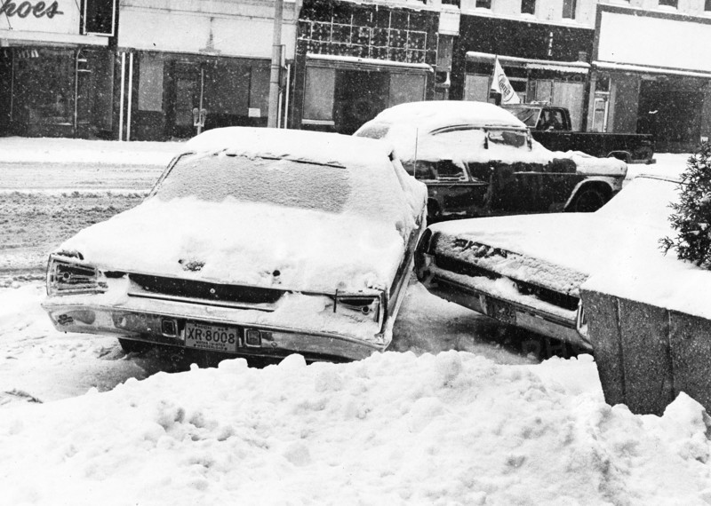 Snowbound Car Stuck Sideways on Street