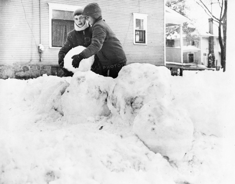 Two Boys Building Snowman in Yard November 1966