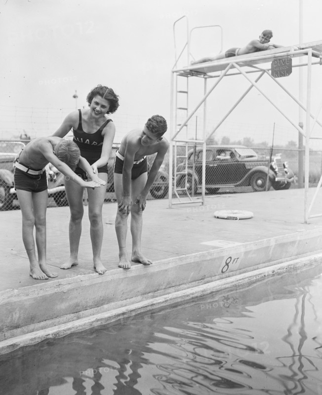 Woman and children at swimming pool