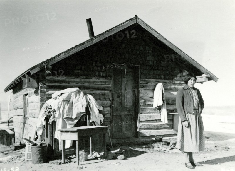 Woman in Front of Cabin