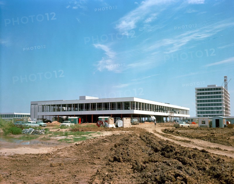 (25 Sept. 1963) This easterly view documents early construction of the Manned Spacecraft Center in September of 1963. The Avionics Systems Laboratory (Building 16) is in the foreground and the Project Management Building is see in the right background.