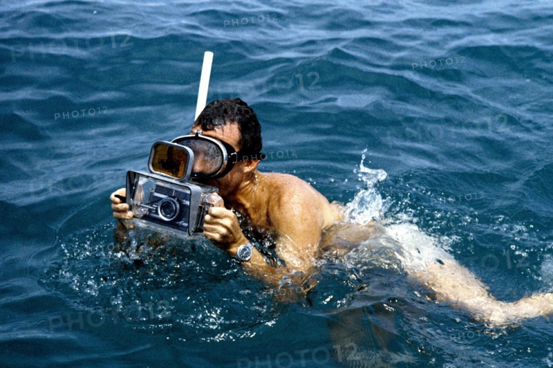Astronaut L. Gordon Cooper participates in Mercury water egress training