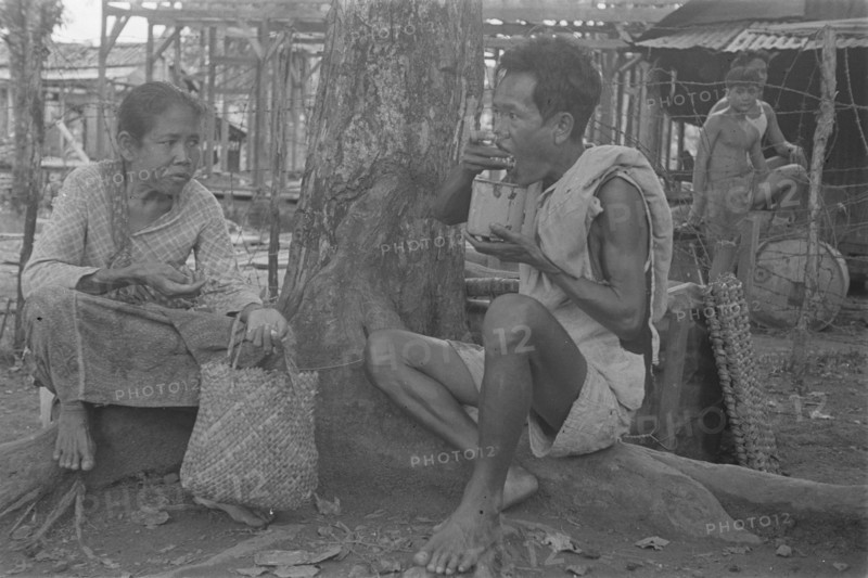 Man and a woman eat; Date January 1947; Location Indonesia, Dutch East Indies, Palembang, Sumatra