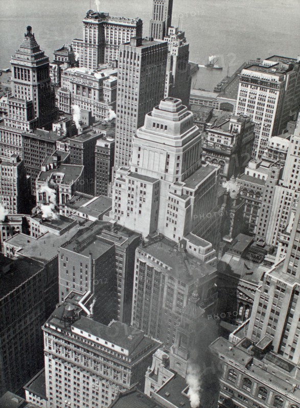 Hudson River and piers just visible at top of view of buildings in lower Manhattan ca. 1938