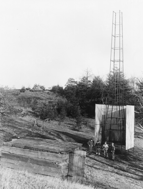 Dr. Robert H. Goddard's tower and shelter at the Army artillery range at Camp Devens, in Ayer, Massachusetts in the winter of 1929-1930. Goddard originally began testing rockets on his aunt's farm in Auburn, Massachusetts until the local police, fire department and townspeople became concerned about the noise and menace to the public the rockets created.