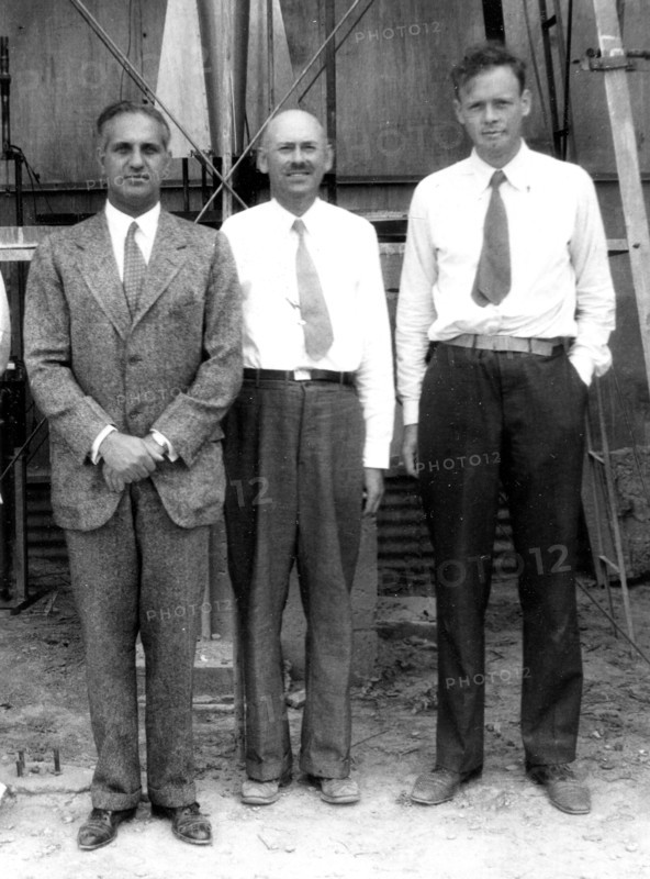 Standing in front of the rocket in the launch tower on September 23, 1935, are (left to right): Harry F. Guggenheim; Dr. Robert H. Goddard; and Col. Charles A. Lindbergh. Charles Lindbergh, an advocate for Goddard and his research, helped secure a grant from the Daniel and Florence Guggenheim Foundation in 1930.