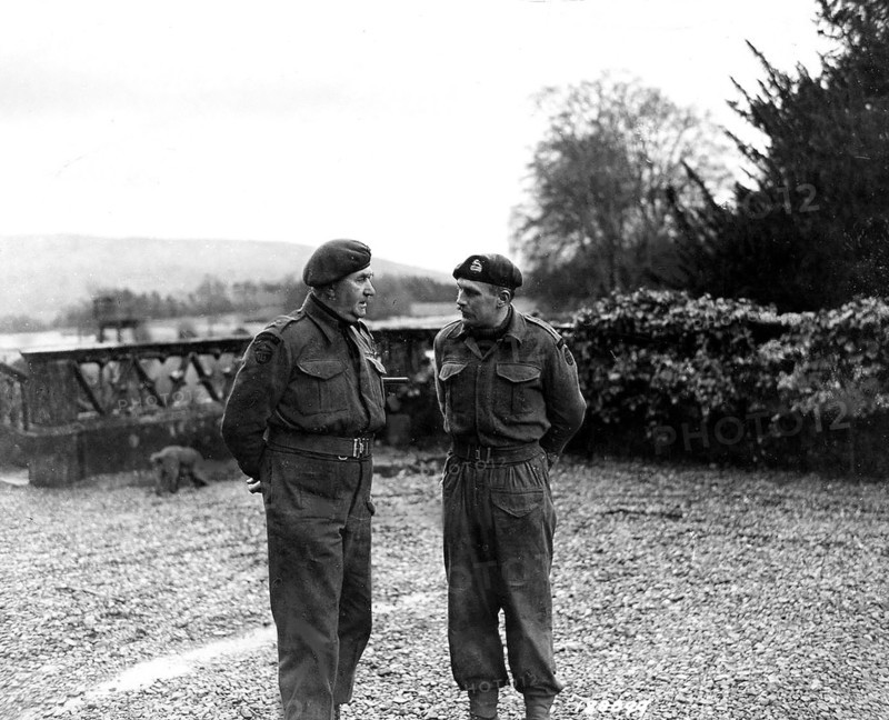 Lt. Col. Vaughan, Commander of a Commando Depot , confers with his second in command, Major Peter Cookcraft, on the day's schedule for a Ranger Unit. Scotland, February 12, 1943. Lt.. Col. C.E. Vaughan of 29th Ranger Battalion., Spean Bridge, Scotland.