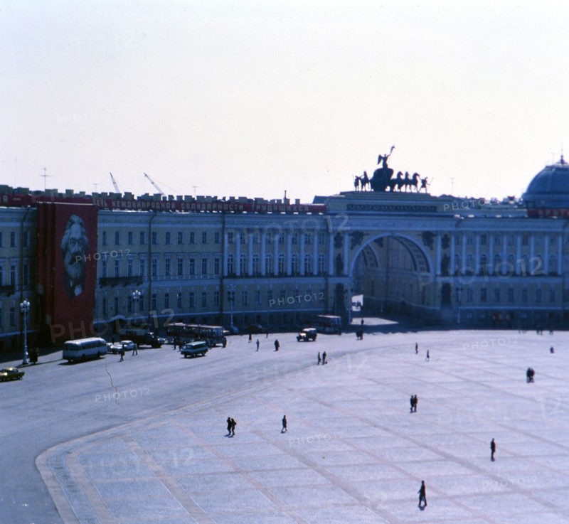 Pedestrians outside of a building (Ministries Buidling) on a cool spring day in St. Petersburg Russia in late 1970s (1978)