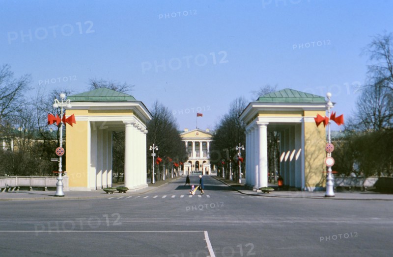 Soviet Buildings and Architecture - buses parked near a building in a large city in Russia in the late 1970s (1978)