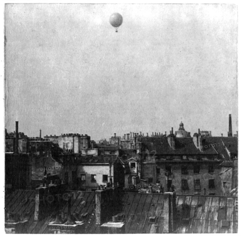 Captive balloon of Henri Giffard over Paris, 1878; high above rooftops