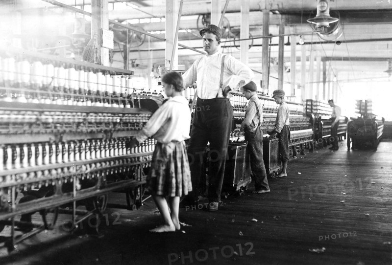 A young spinner in Yazoo City Yarn Mills. Said she was 13, but doubtful, May 1911