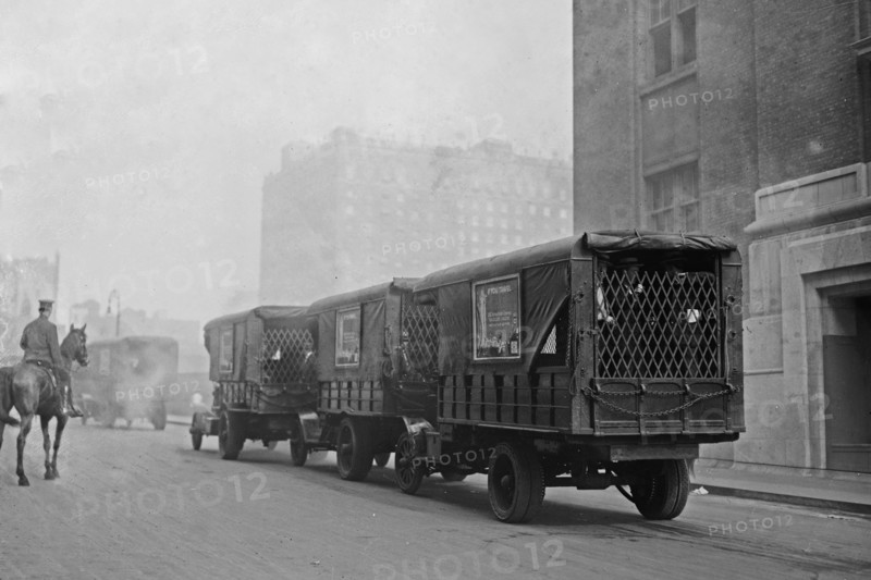 Photograph shows American Express trucks transporting gold shipped by Great Britain to New York City for safe-keeping during World War I ca. September 8, 1915