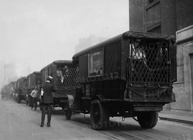 Photograph shows American Express trucks transporting gold shipped by Great Britain to New York City for safe-keeping during World War I ca. September 8, 1915