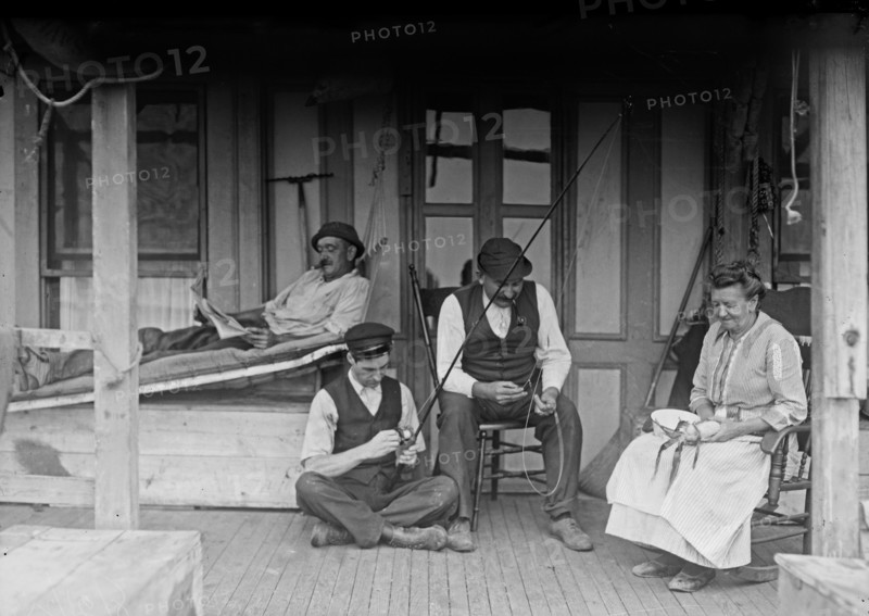 Family on a porch of a home in Broad Channel, Queens ca. 1910-1915