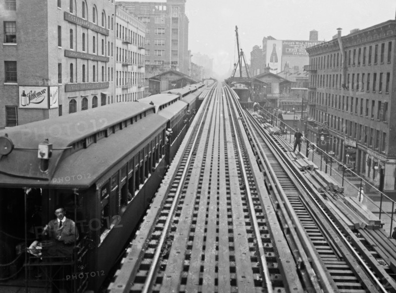 Express tracks of the Ninth Avenue El (elevated railroad) with a train, at the 14th Street Station in New York City ca. 1914-1915