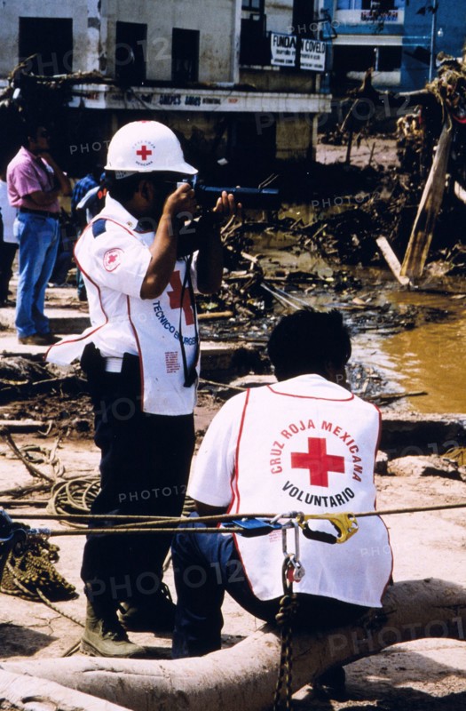 Red Cross worker documenting the damage in Tegucigalpa Honduras caused by Hurricane Mitch ca. September 1989