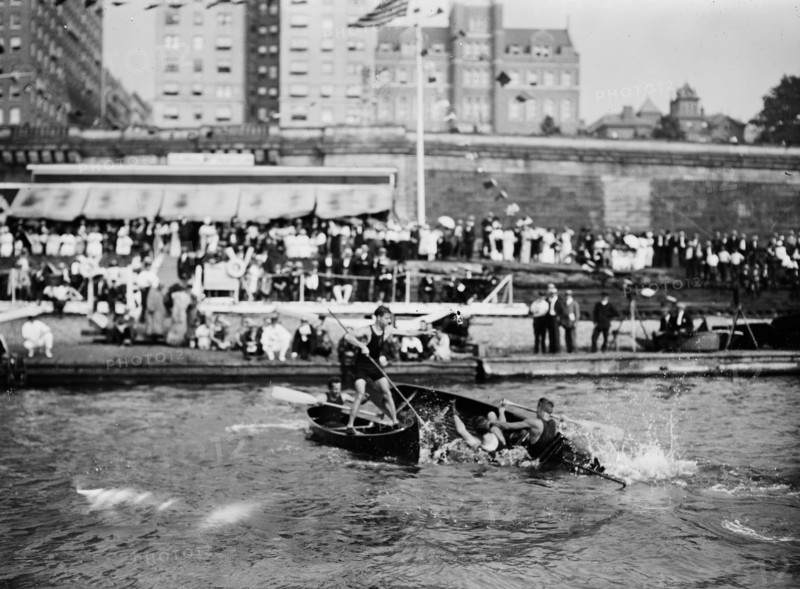 Men enjoying the summer fun of canoe tilting ca. 1910-1915