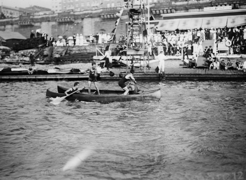 Men enjoying the summer fun of canoe tilting ca. 1910-1915