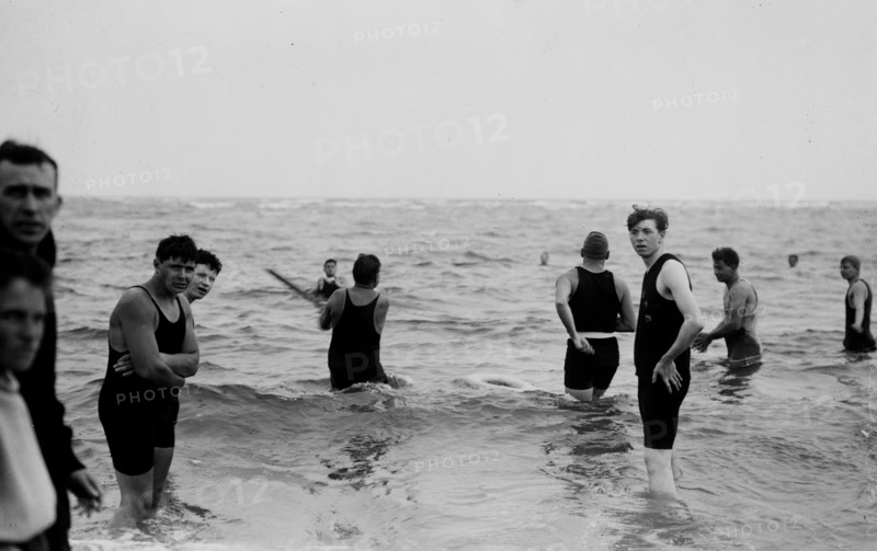 Men playing water baseball ca. 1914