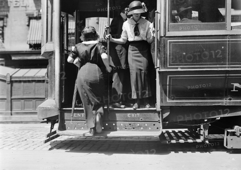 Woman boarding Broadway street car in New York ca. 1910-1915