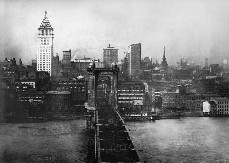 Cincinnati suspension bridge from the Kentucky side looking down on the flooded Ohio River and downtown Cincinnati in 1913