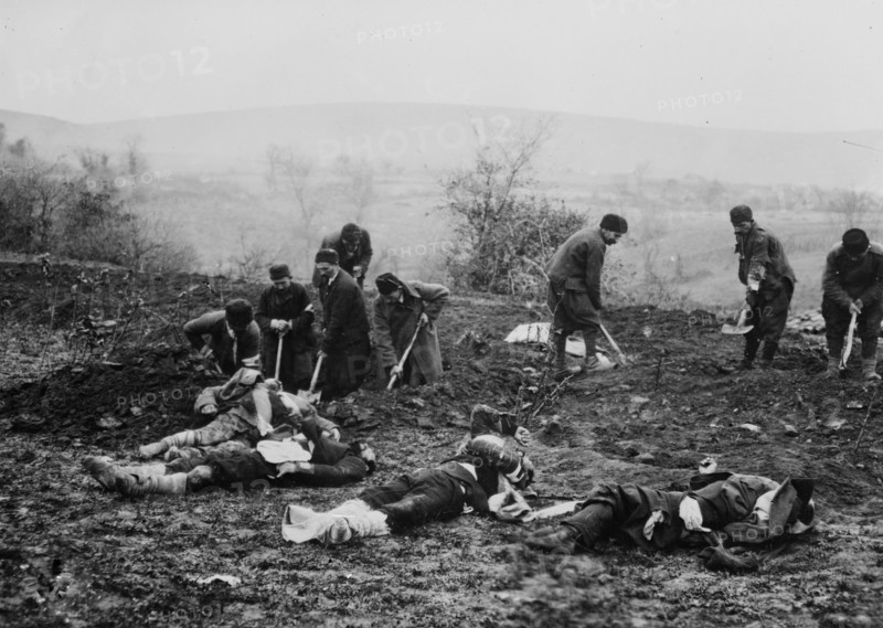 Troops (probably Bulgarians) burying dead soldiers at Çatalca, Turkey during the Balkan Wars ca. 1912-1913