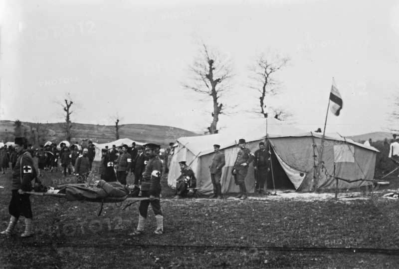 Medical personnel (probably Bulgarians) carrying man on stretcher at Çatalca, Turkey during the Balkan Wars ca. 1912-1913