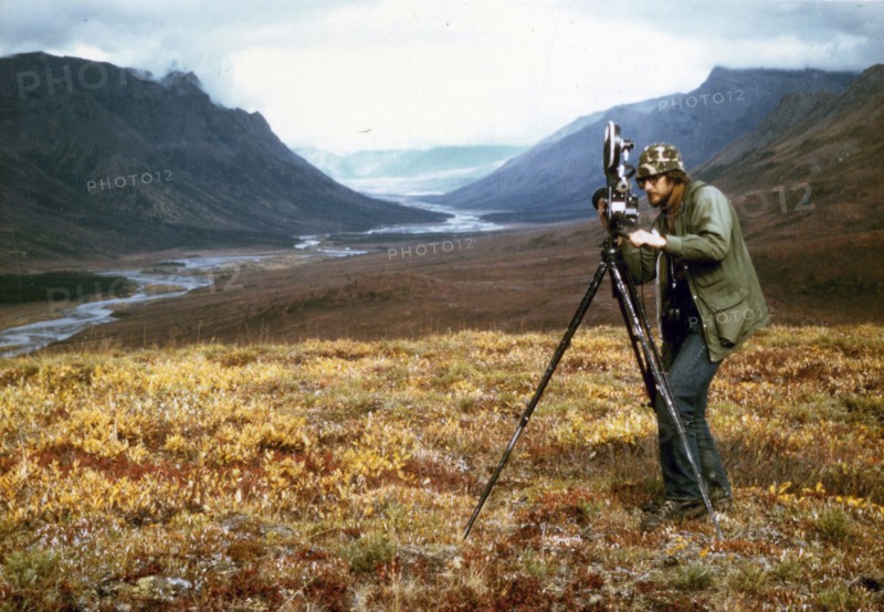 Cameraman filiming at Gates of the Arctic, Alaska ca. 1975