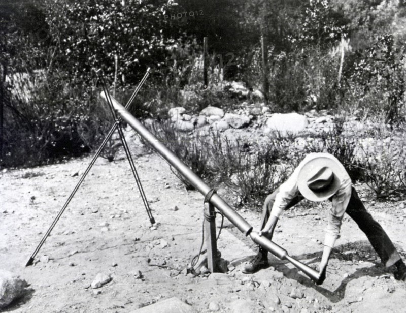 Dr. Robert H. Goddard loading a 1918 version of the Bazooka of World War II.
