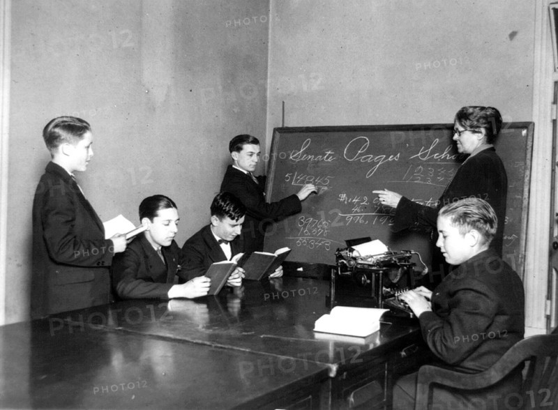 Teacher and five boys in Senate Pages' School - boy typing ca. 1909-1932