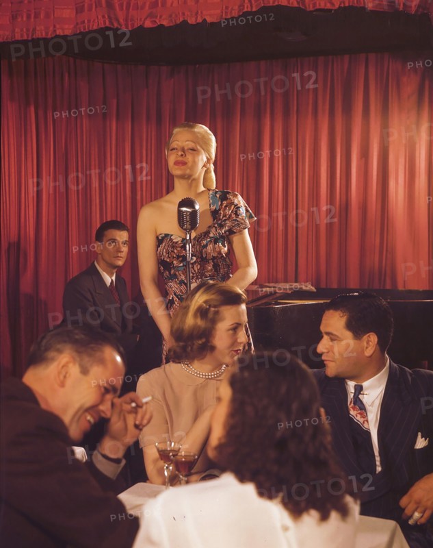 Woman signing at a jazz night club ca. 1948