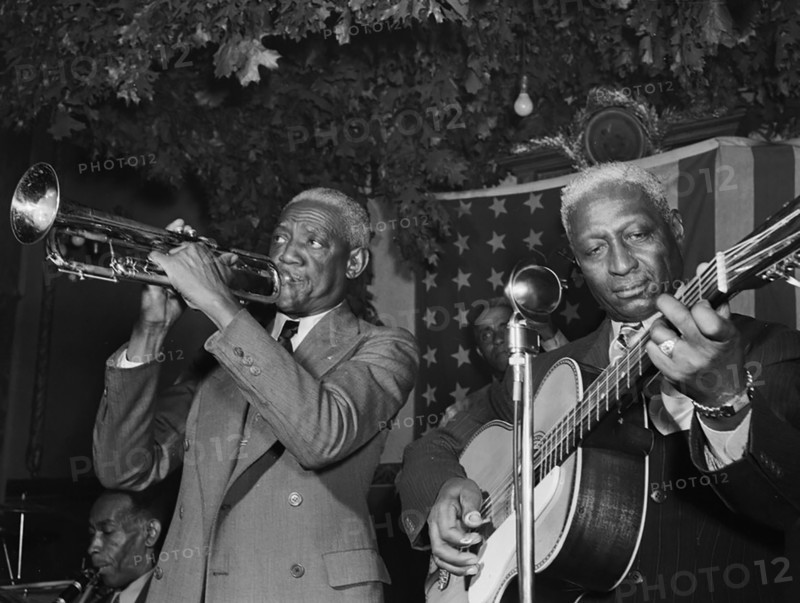 Portrait of Bunk Johnson, Leadbelly, George Lewis, and Alcide Pavageau, Stuyvesant Casino, New York, N.Y., ca. June 1946