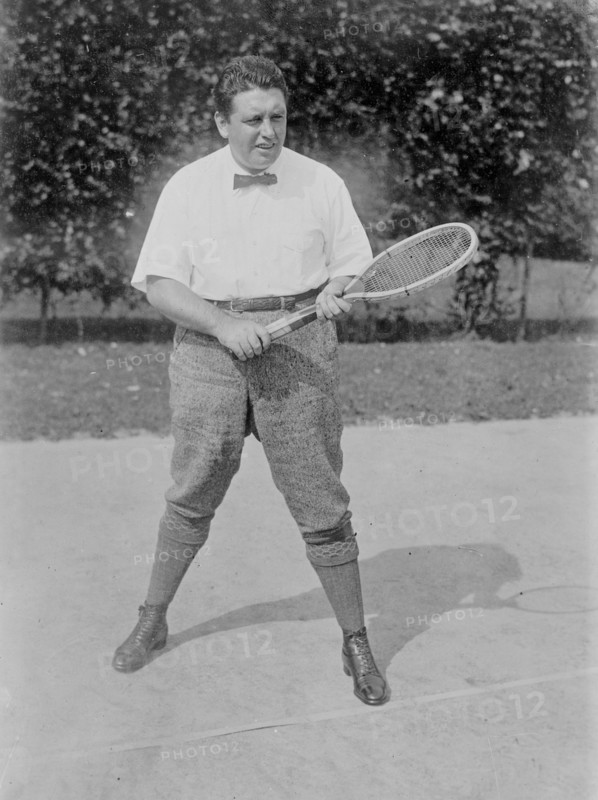 Photograph shows Irish American tenor singer John McCormack (1884-1945) playing tennis