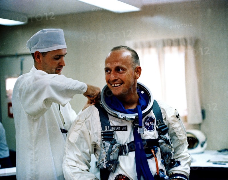 (12 July 1965) Astronaut Charles Conrad Jr. receives assistance with his pressure suit during suiting up and ingress test activity at Pad 16, Cape Kennedy, Florida in preparation for Gemini-5 spaceflight